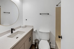 A modern bathroom with a white sink, black faucet, and a toilet. - Beautiful Ski-in/ski-out Condo Located On The Eagle Point Resort! 1 Bedroom Condo by RedAwning (Beaver)