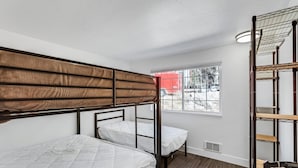 A bunk bed room with a window, a radiator, and a wooden ladder. - Beautiful Ski-in/ski-out Condo Located On The Eagle Point Resort! 1 Bedroom Condo by RedAwning (Beaver)