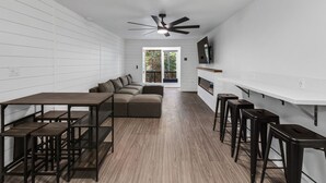 A modern kitchen with a wooden countertop, a built-in oven, and a ceiling fan. - Beautiful Ski-in/ski-out Condo Located On The Eagle Point Resort! 1 Bedroom Condo by RedAwning (Beaver)
