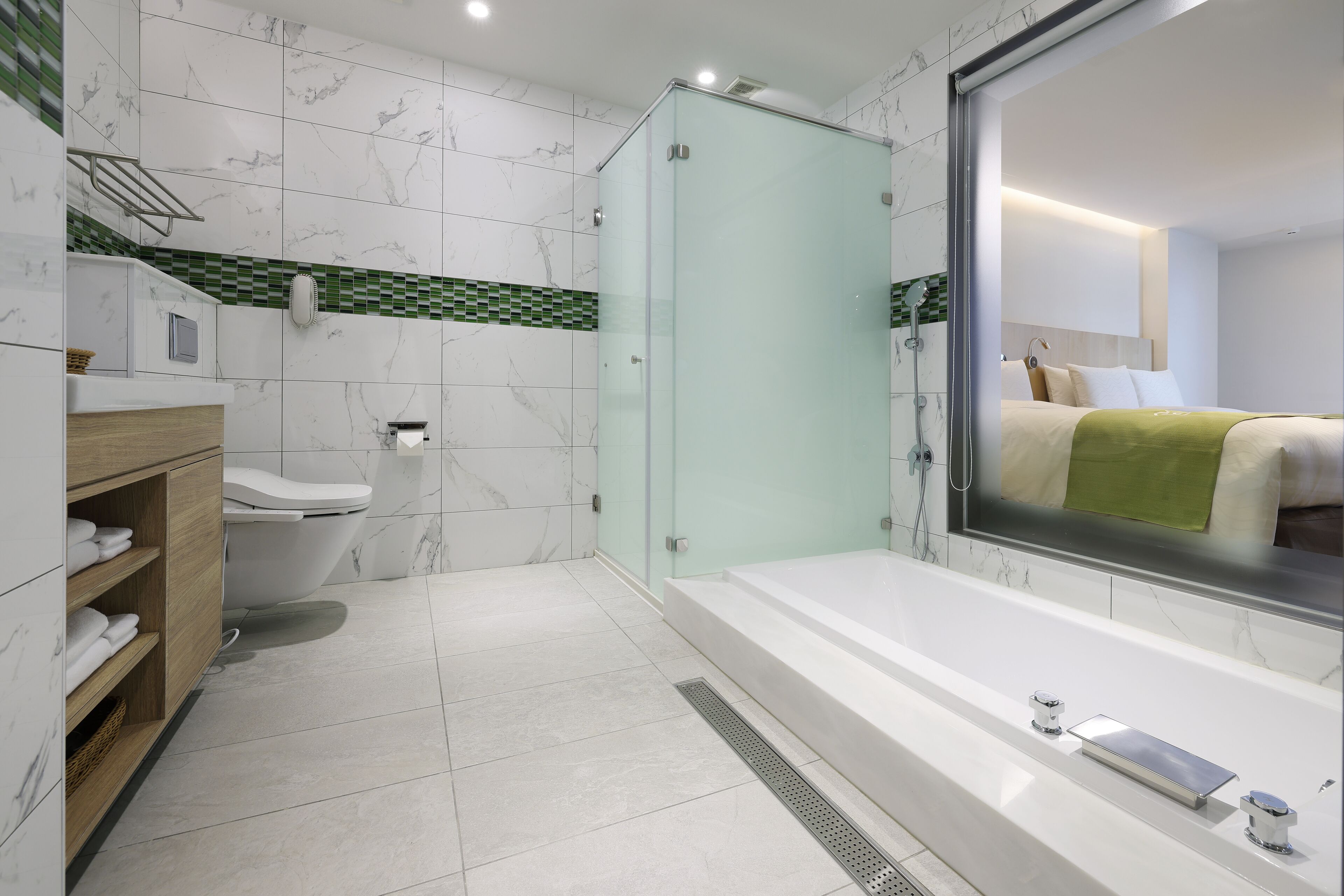 A modern bathroom with a glass-enclosed shower, a large mirror, and a bathtub.
