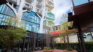 A modern building with multiple balconies and large windows. - CHECK inn MAGI Kids (Luodong)