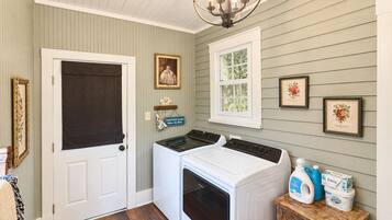 Laundry room. The door leads to the parking area beside the cottage.