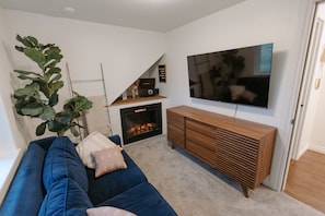 Smart TV, fireplace, books