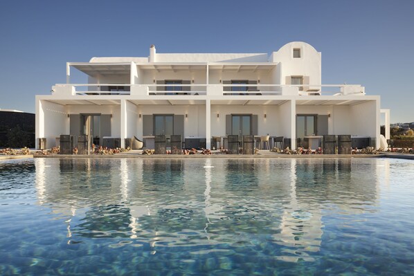 A modern white building with a pool in front. - Absolute Paradise Santorini- Adults Only (Santorini)