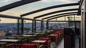 A rooftop terrace with seating and a city view. - Grand Balyan Hotel & Restaurant (Istanbul)