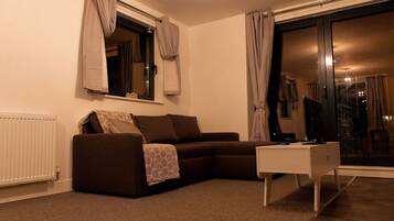 Apartment, 1 Queen Bed with Sofa bed | Living room | 30-inch TV with cable channels