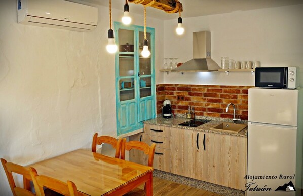 Fridge, microwave, stovetop, coffee/tea maker