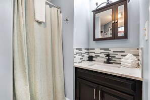 Bathtub, hair dryer, towels