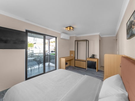 Comfort Room | Desk, laptop workspace, blackout drapes, iron/ironing board