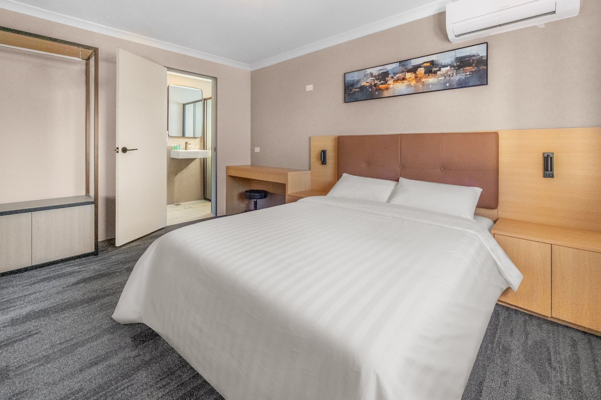 Desk, laptop workspace, blackout curtains, iron/ironing board