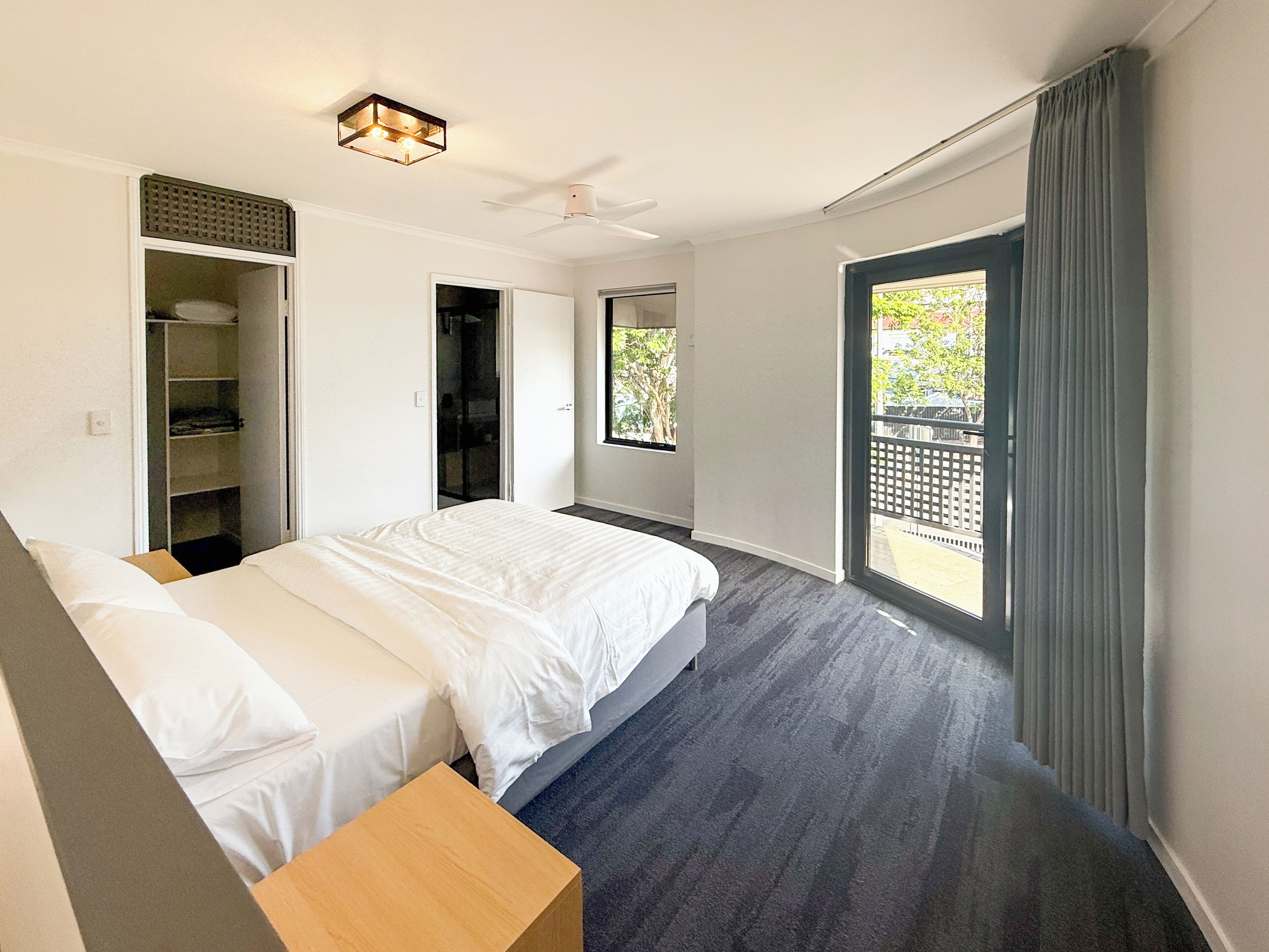 Comfort Townhome | Desk, laptop workspace, blackout drapes, iron/ironing board