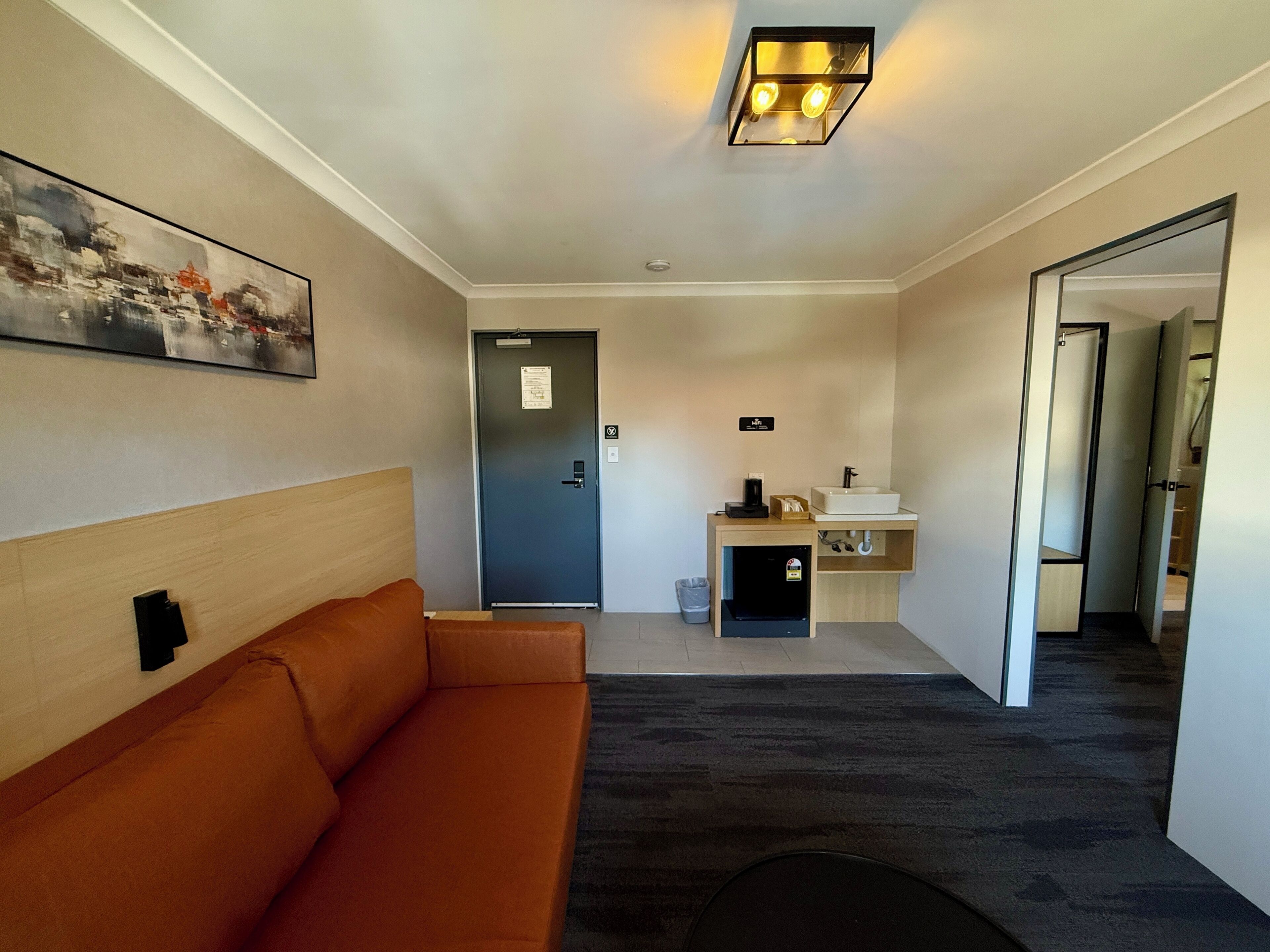 Deluxe Quadruple Room | Desk, laptop workspace, blackout drapes, iron/ironing board