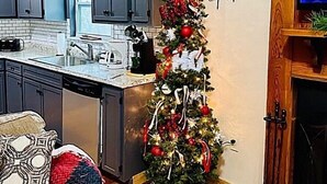 A kitchen with grey cabinets, a wooden ceiling, and a small Christmas tree with ornaments. - GREAT EXPECTATIONS - 2 Bdrm/2 Bath, wood burning fireplace, secluded, Laurel Valley (Townsend)