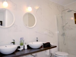 Shower, hair dryer, towels, soap