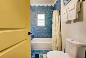 Bathtub, hair dryer, towels