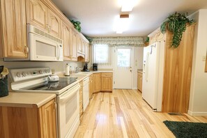 Fridge, microwave, oven, stovetop - Experience the South Fork Cabin, a cozy 3-bedroom retreat just 6 minutes from Yellowstone. (West Yellowstone)