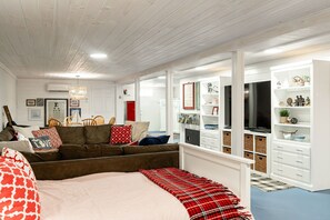 Relax in this serene space with a large bed, sofa, and desk, perfect for unwinding.