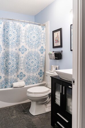 Combined shower/tub, hair dryer, towels, soap