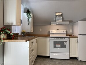 Fridge, oven, stovetop, dining tables