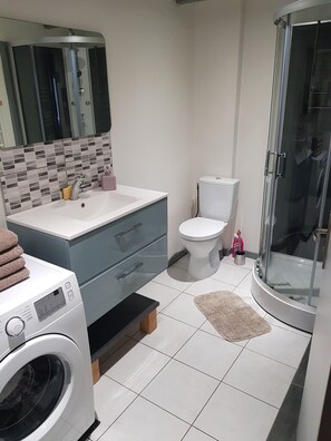 Shower, hair dryer, towels, soap