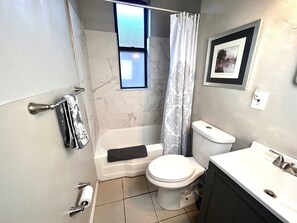 Combined shower/tub, hair dryer, towels, shampoo