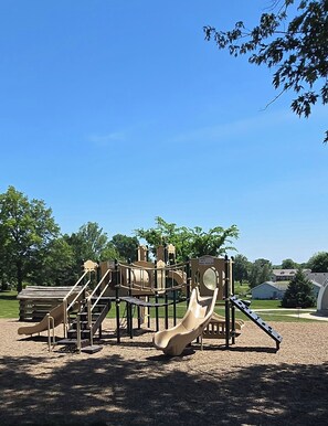 A playground with slides and climbing structures. - Come relax in this beautiful 3 bedroom house with lots of space! cozy & clean! (Wellman)