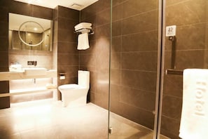 A modern bathroom with a glass shower enclosure, a toilet, and a sink. - Botai Hotel (Yongqing)