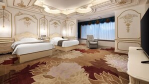 A luxurious bedroom with two beds, a large floral carpet, and ornate ceiling decorations. - Botai Hotel (Yongqing)