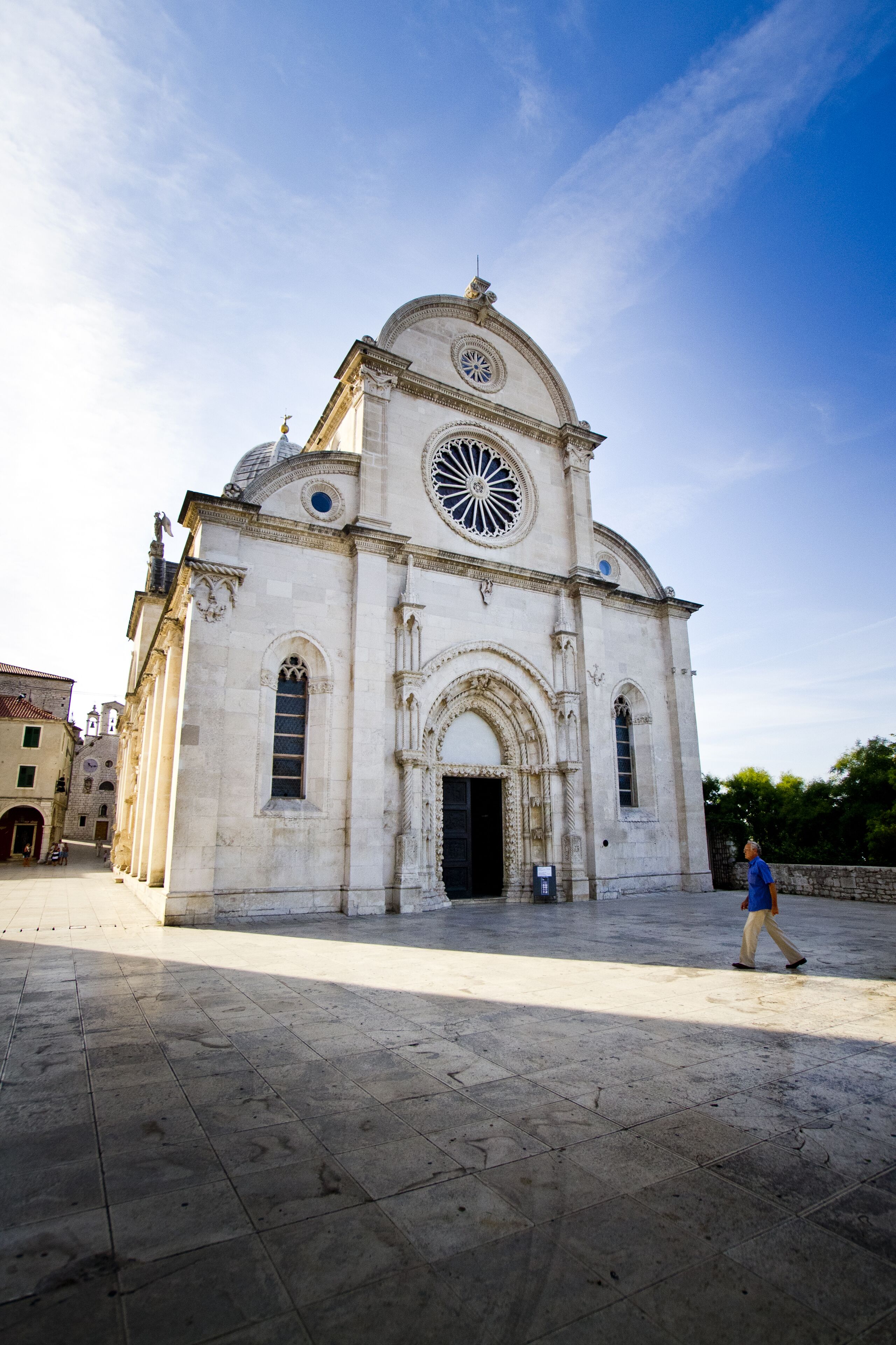 A historic building with a large central dome and arched windows.