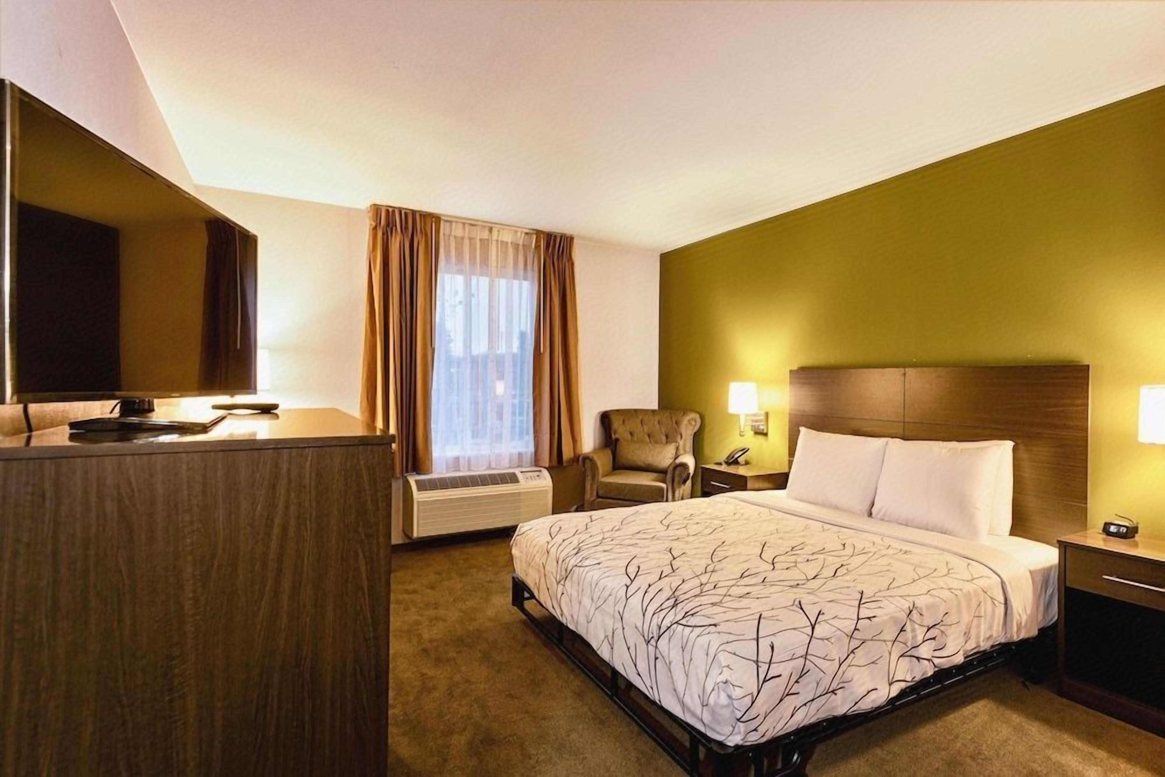 Premium bedding, desk, laptop workspace, blackout drapes