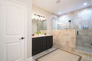 Combined shower/tub, hair dryer, towels, soap