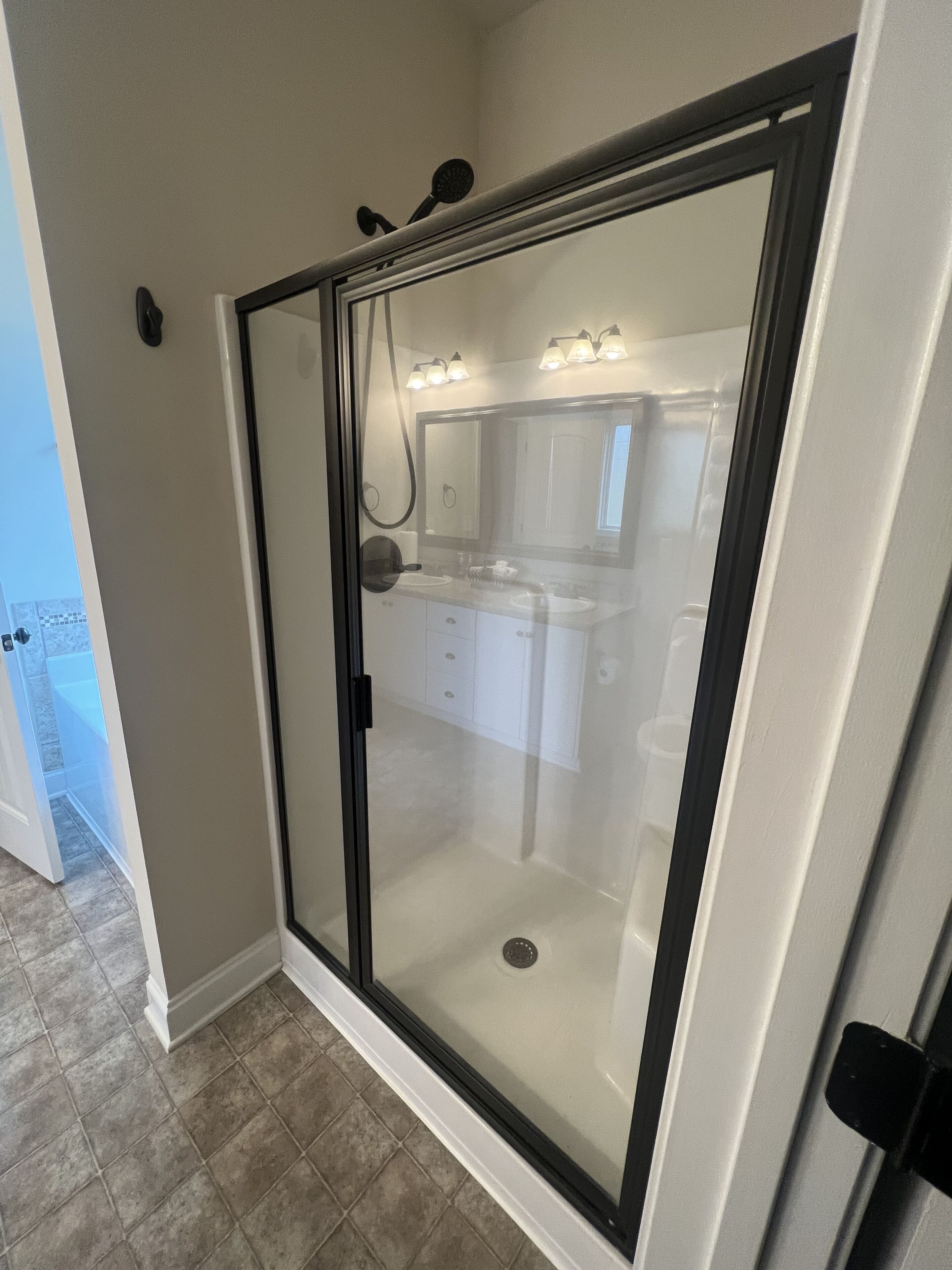 Combined shower/bathtub, hair dryer, towels, soap