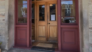 A building entrance with a sign reading "DUNSTAN HOUSE". - Dunstan House (Clyde)