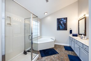 Combined shower/bathtub, hair dryer, towels, soap
