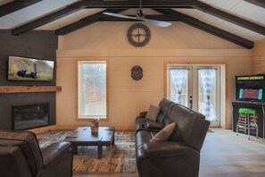 Smart TV, fireplace, table football, books