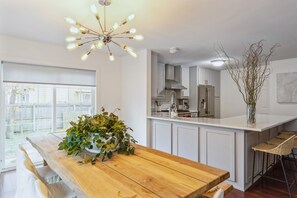 Enjoy cooking in this kitchen with a central island and large window.
