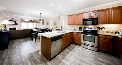 Riverfront oasis with dual suites, 3 fireplaces, central AC, & walkable locale