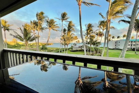 Property grounds. Ocean view condo with shaded lana'i, WiFi & shared pool, tennis, grills, cabana