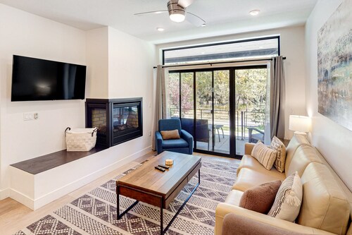 Ground-Floor, Riverfront Getaway with a Gas Fireplace, WiFi, & Furnished Patio