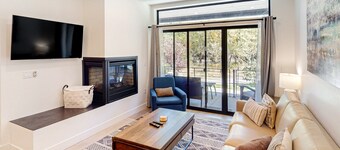 Ground-Floor, Riverfront Getaway with a Gas Fireplace, WiFi, & Furnished Patio