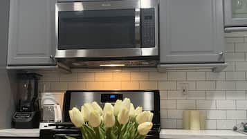 Microwave, coffee/tea maker, cookware/dishes/utensils