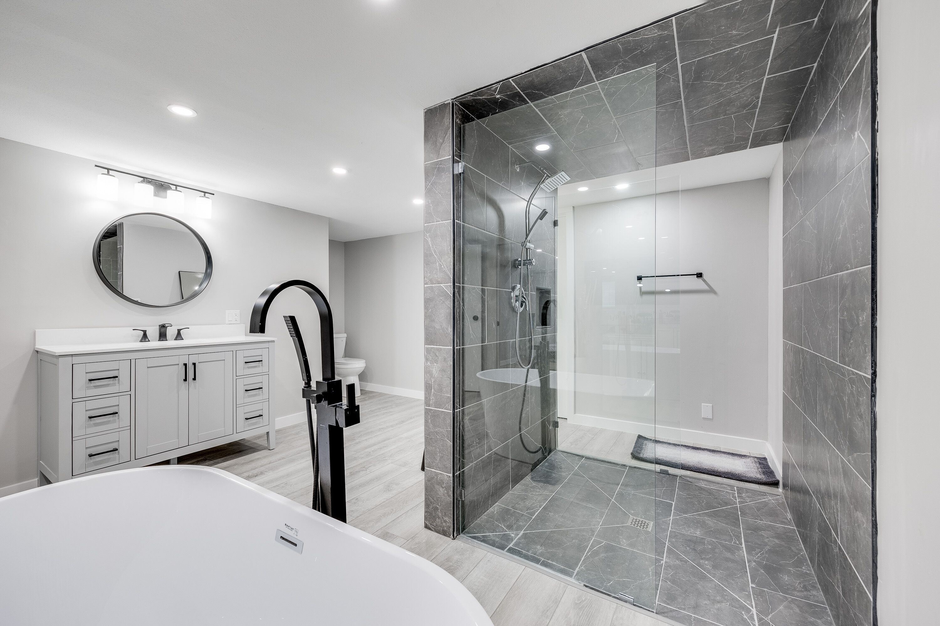 Bathtub, hair dryer, towels, toilet paper
