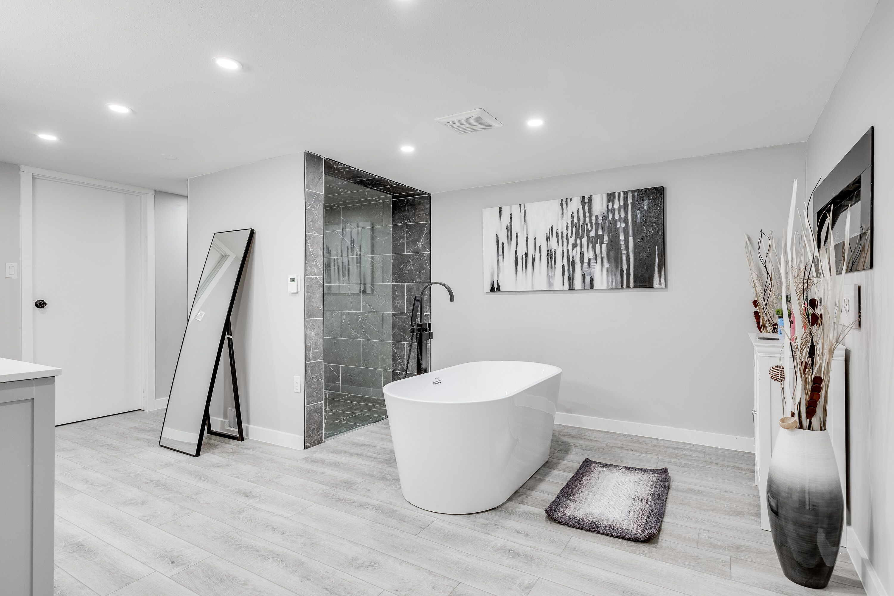 Bathtub, hair dryer, towels, toilet paper