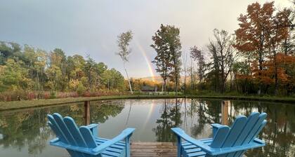 Home with a spring-fed pond and mountain view.