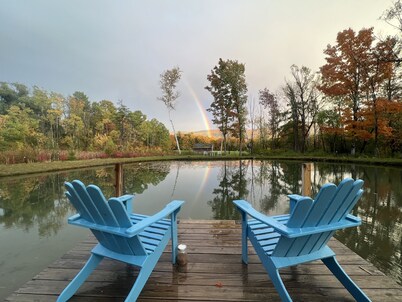 Home with a spring-fed pond and mountain view.
