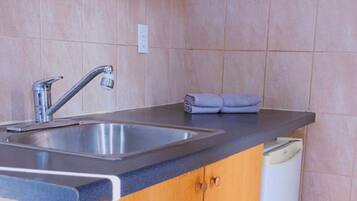 Mini-fridge, microwave, paper towels