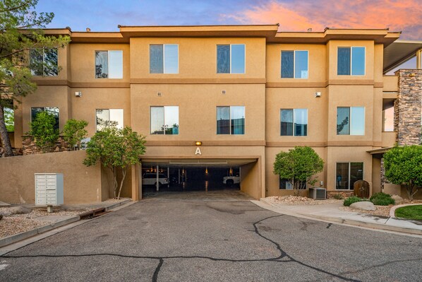 A multi-story building with a parking garage entrance labeled 'A'.