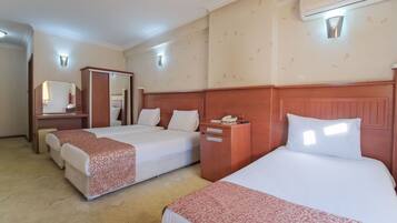 Standard Triple Room | Blackout drapes, free WiFi, bed sheets