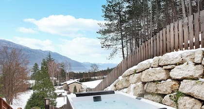 Appartement de vacances "Wellness Lodge Chicca" avec vue sur le lac, sauna et Wi-Fi