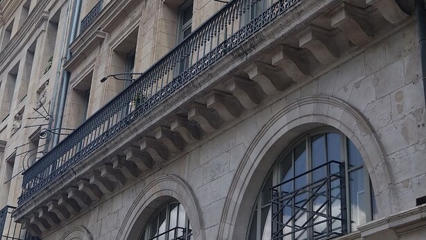 A multi-story building with a classical architectural style, featuring arched windows and ornate balconies. - LUMINOUS COMFORT CALM (Rouen)